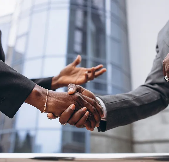 Photo of two executives shaking hands
